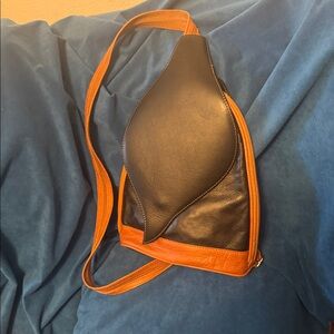 Chair, beautiful, black and brown convertible backpack to Crossbody 100%leather